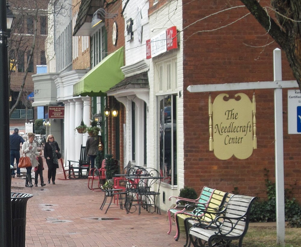 Davidson-Shoppers walking along the retail storefronts on Main Street in downtown Davidson, North Carolina.